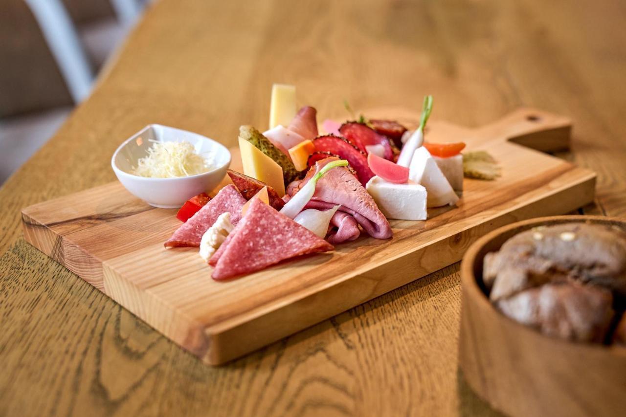 A-Rosa Ifen Hotel Kleinwalsertal Хиршегг Экстерьер фото A selection of cured meats and cheese